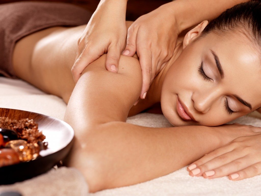 woman enjoying relaxing massage at the spa