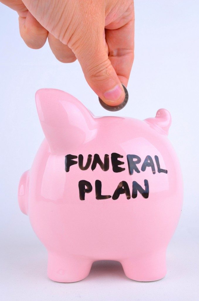 Saving For A Funeral in a pink Piggy bank