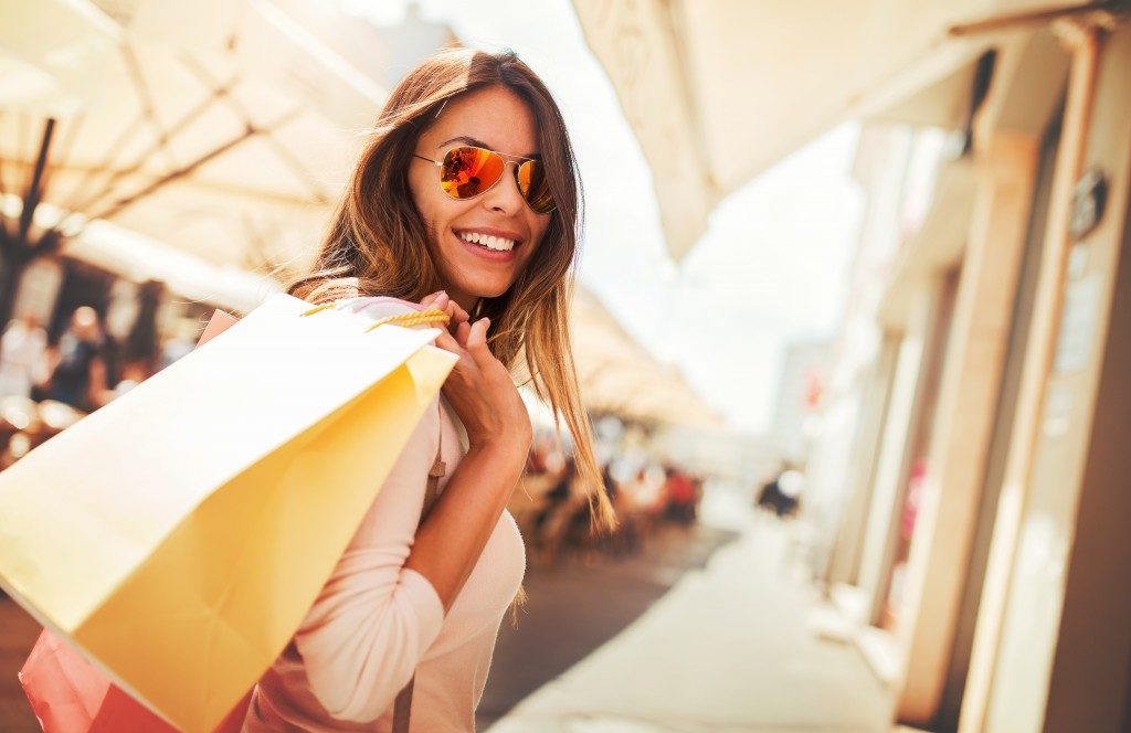 Woman shopping and holding shopping bags