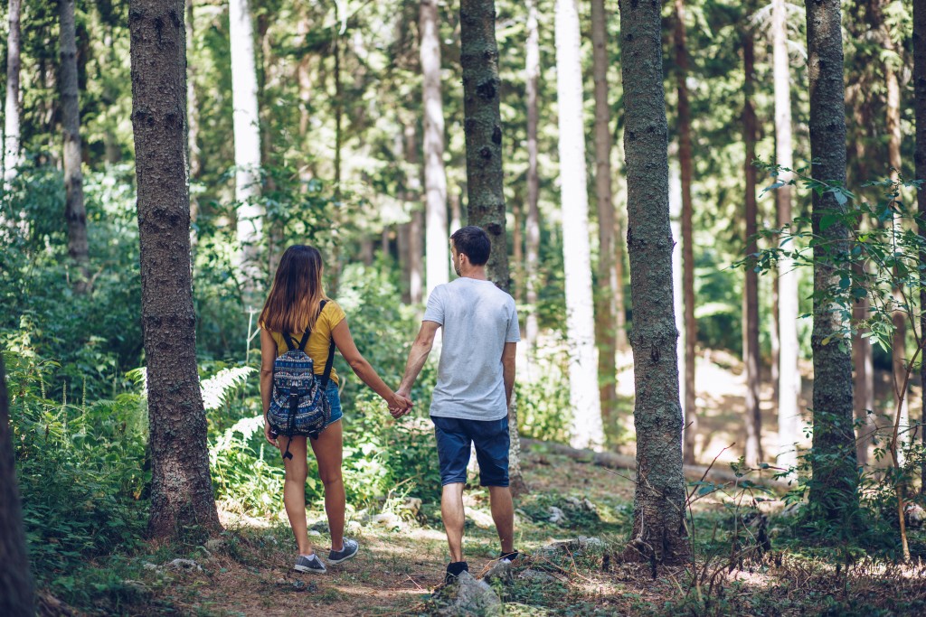 couple walking in the woods